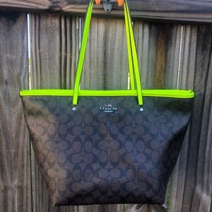 Dark brown and neon green Coach purse